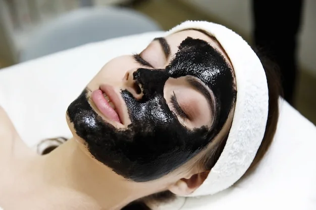 A client resting with a treatment mask on during a facial session